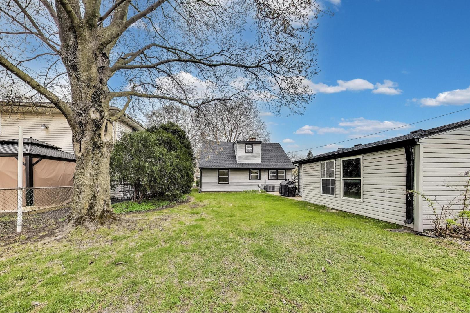 139 South Quentin Road Palatine, IL 60067 - Photo 18 of 23 a view of a house with a yard