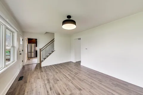 a view of entryway with wooden floor