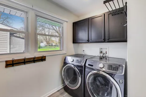 a view of a kitchen with washer and dryer