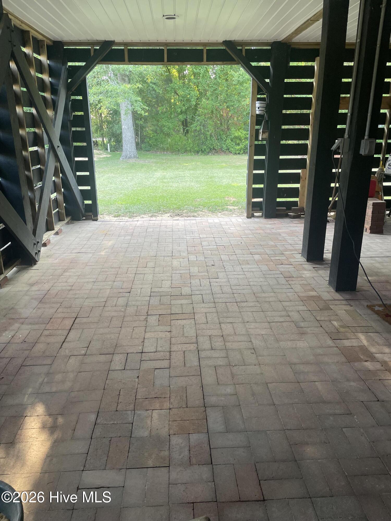 97 Woodbury Road Elizabethtown, NC 28337 - Photo 7 of 26 Parking and storage below - Classic brick pavers; Enclose to add sq ft. ?