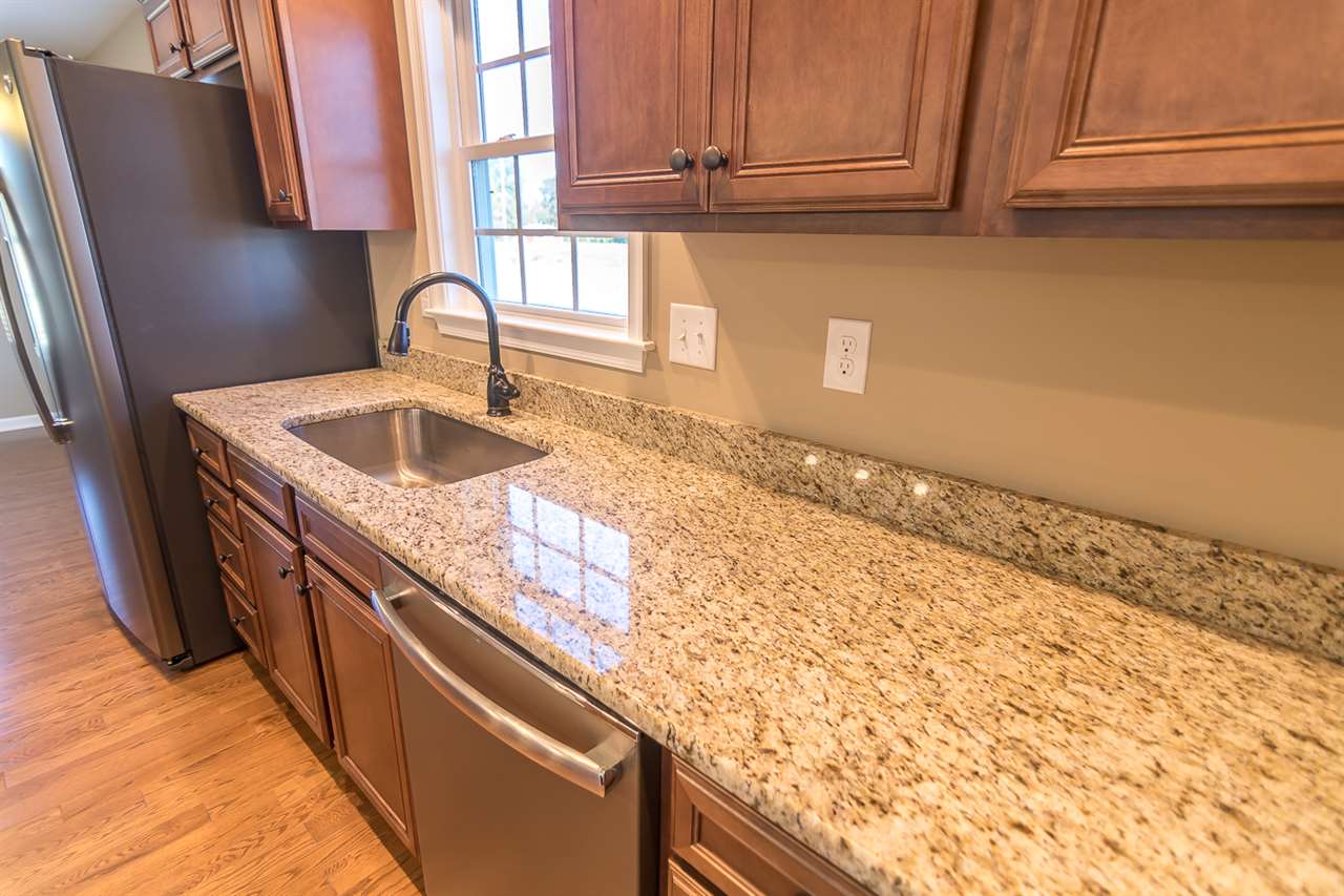 900 Riverside Avenue Grottoes, VA 24441 - Photo 18 of 37 a kitchen with granite countertop a sink and a stove