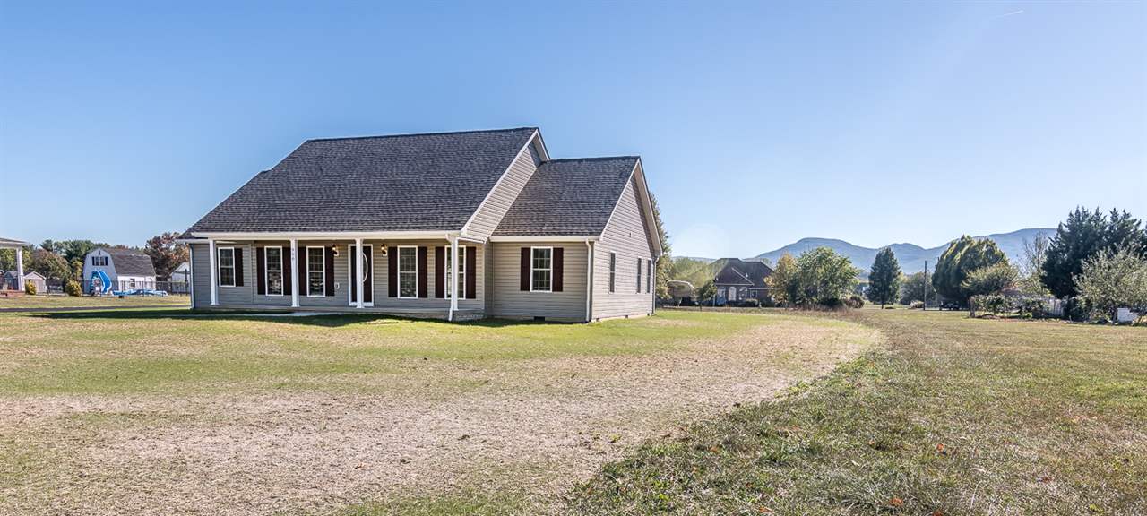 900 Riverside Avenue Grottoes, VA 24441 - Photo 2 of 37 a front view of a house with a yard