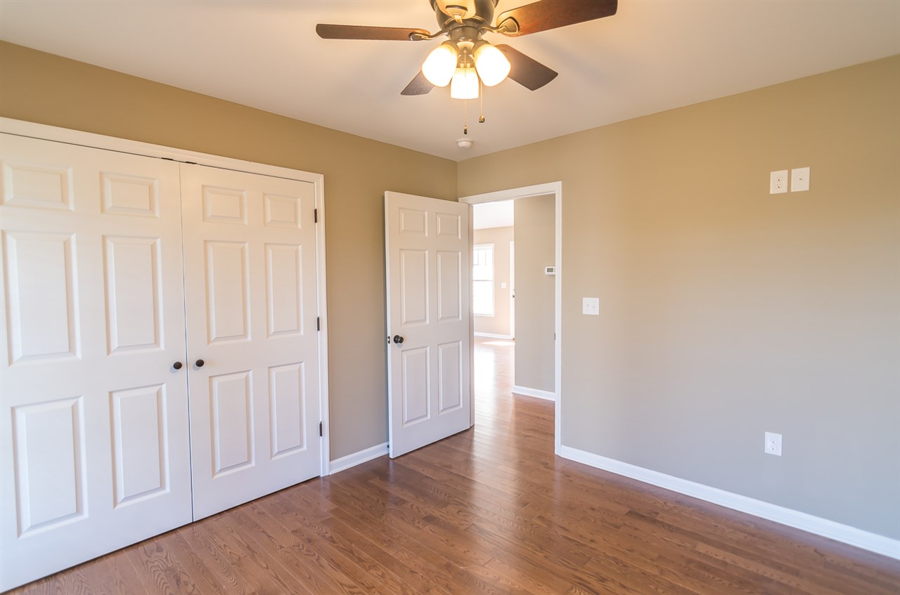 900 Riverside Avenue Grottoes, VA 24441 - Photo 23 of 37 a view of an empty room with window and wooden floor