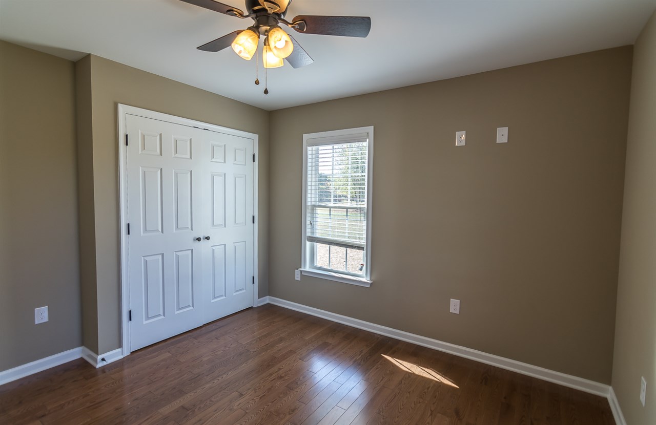 900 Riverside Avenue Grottoes, VA 24441 - Photo 26 of 37 a view of an empty room with a window and wooden floor