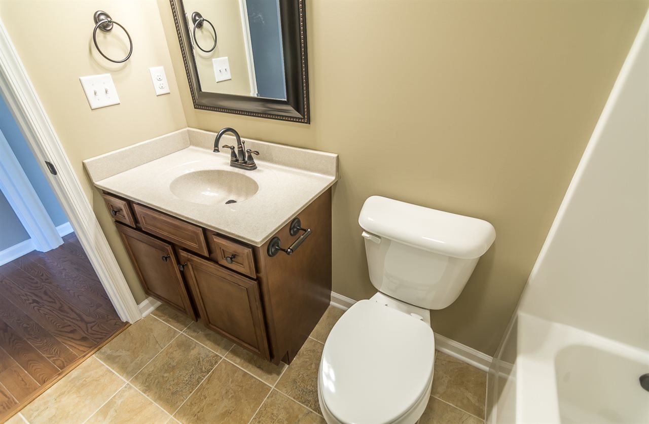 900 Riverside Avenue Grottoes, VA 24441 - Photo 28 of 37 a bathroom with a toilet sink and mirror