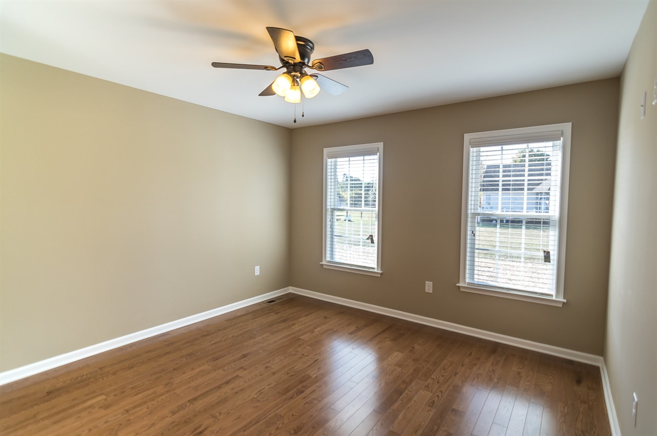 900 Riverside Avenue Grottoes, VA 24441 - Photo 30 of 37 an empty room with wooden floor and windows