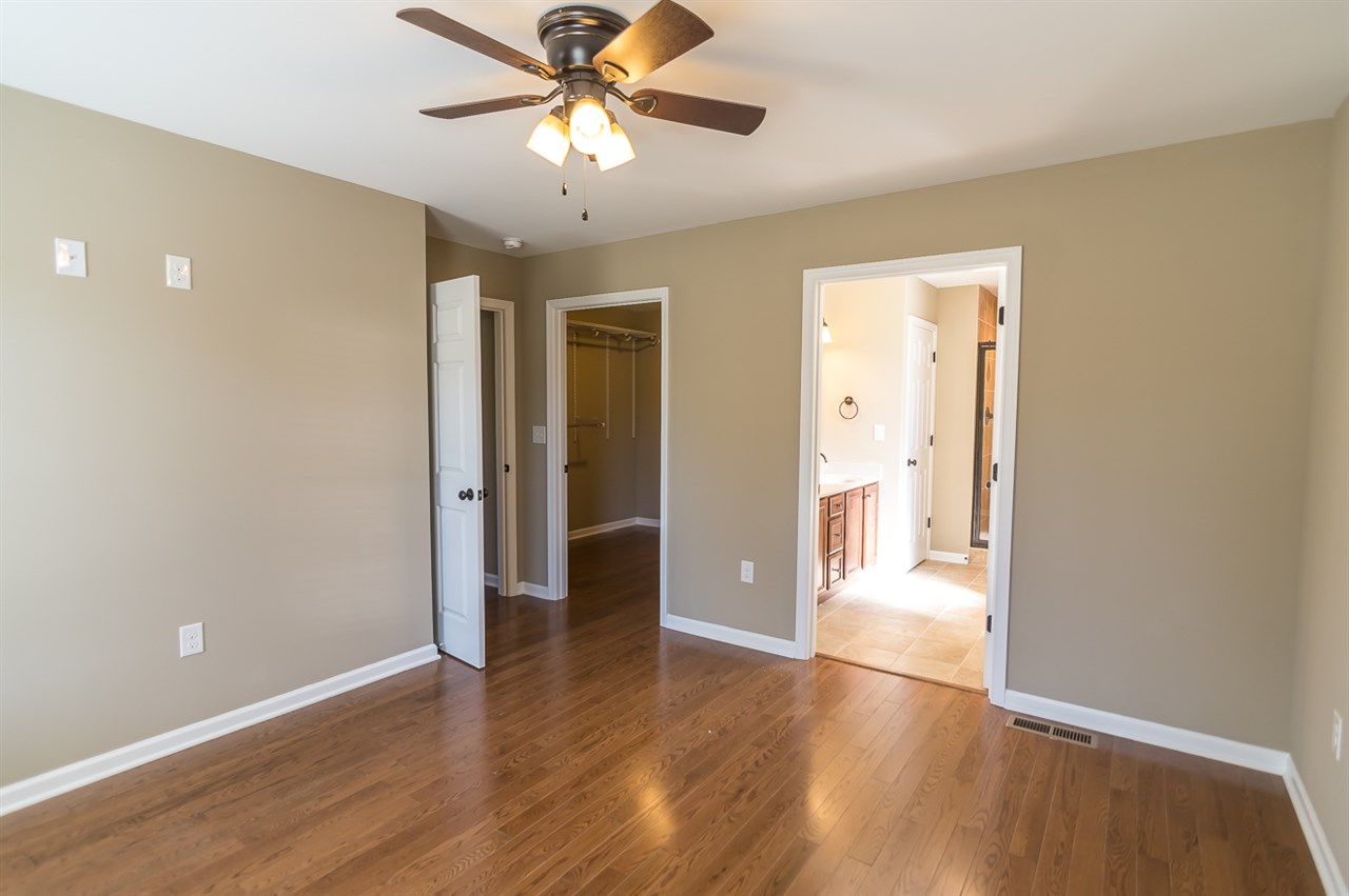 900 Riverside Avenue Grottoes, VA 24441 - Photo 31 of 37 an empty room with wooden floor and ceiling fan