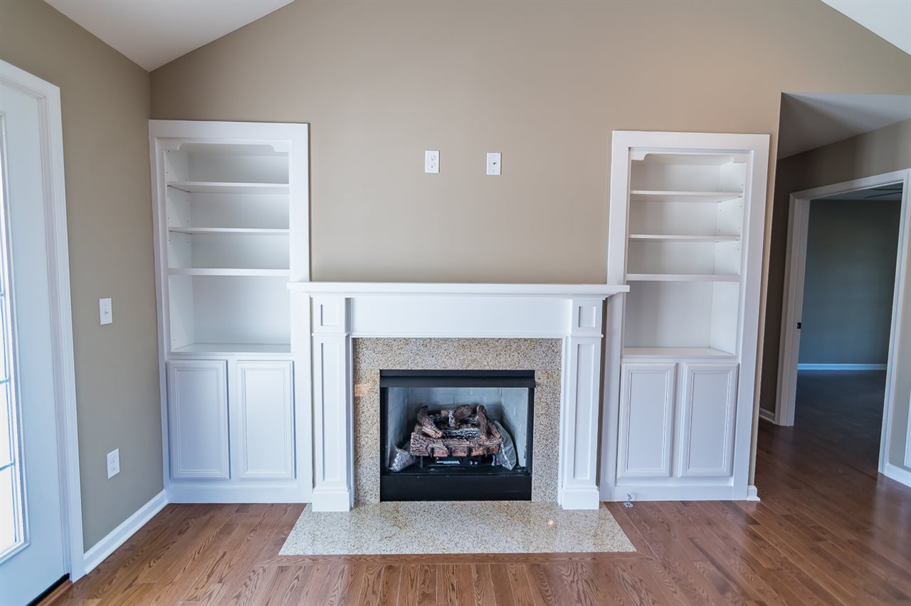 900 Riverside Avenue Grottoes, VA 24441 - Photo 7 of 37 a living room with a fireplace and a wooden floor