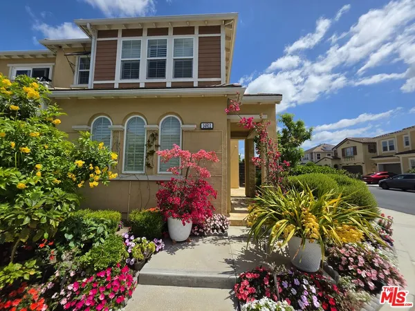 a kitchen with refrigerator a stove a sink and cabinets