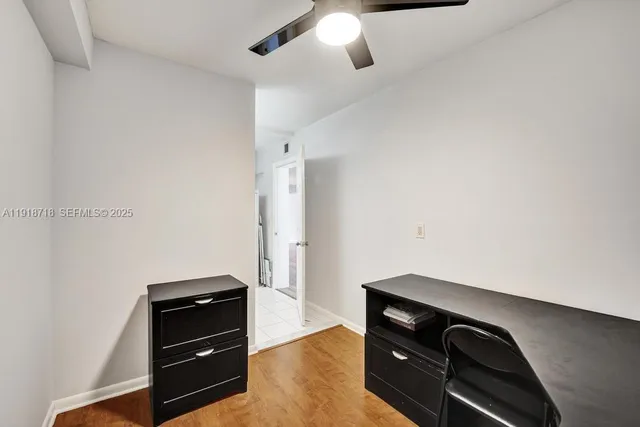 a room with closet and wooden floor