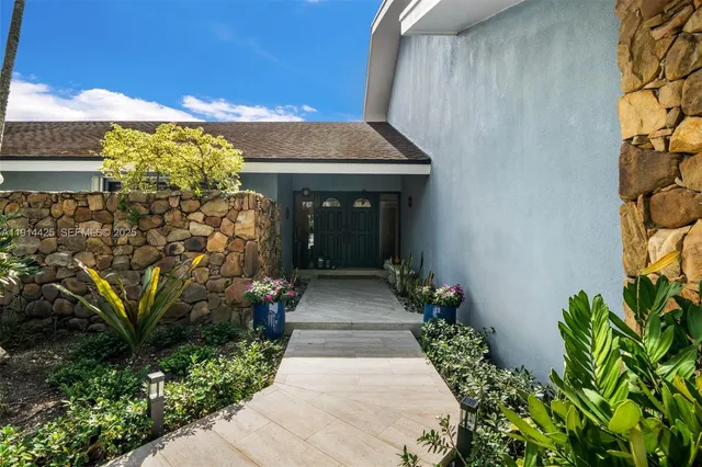 a entryway with flower garden