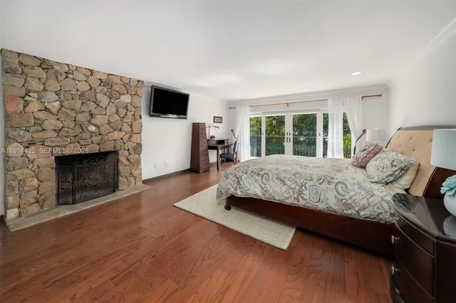 a bedroom with a bed and a fireplace