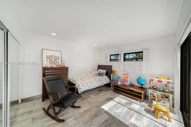 a bedroom with furniture and a bed