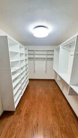 a view of a room with storage and racks on wall