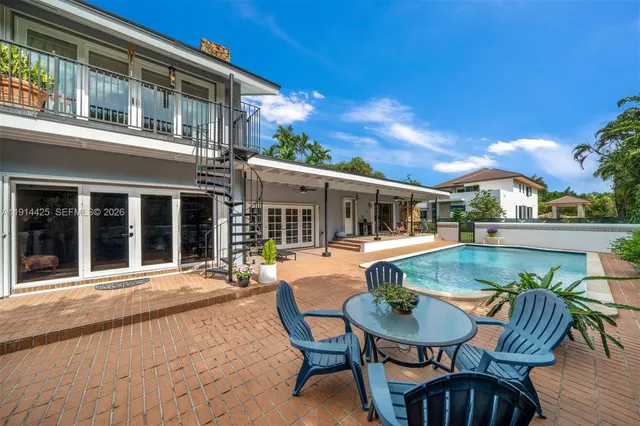 a view of swimming pool with a patio