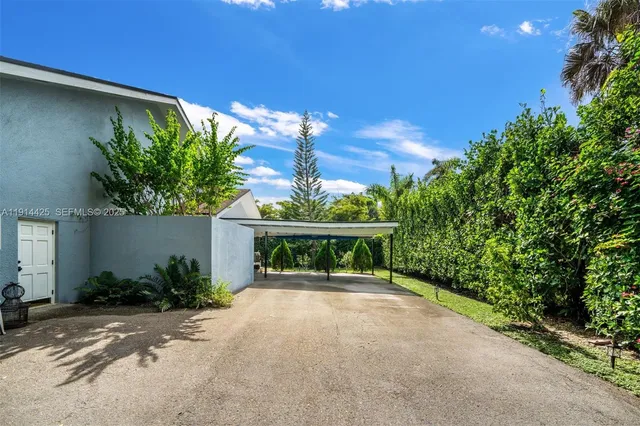 an aerial view of a house with a garden
