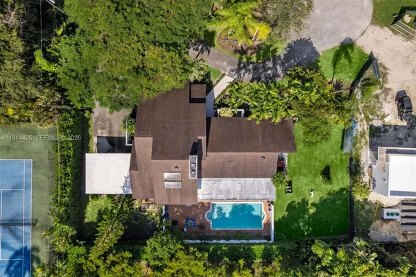 a house that has a tree in front of it