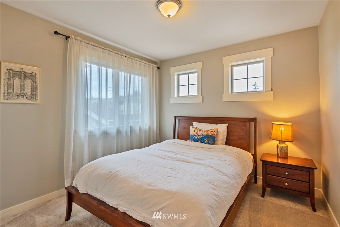 26 212th Street Southwest Bothell, WA 98021 - Photo 22 of 25 a bedroom with a bed and a window