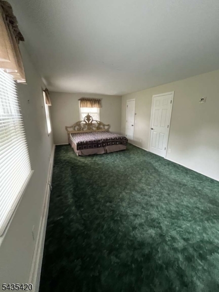 619 Foothill Road Bridgewater, NJ 08807 - Photo 17 of 23 a view of a livingroom with an empty space and a window