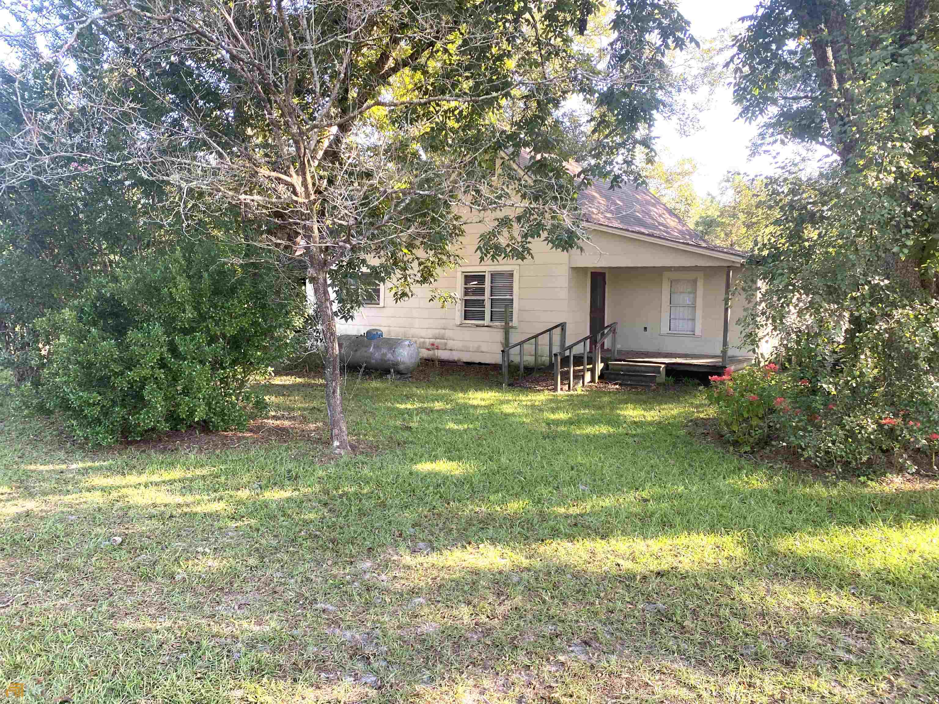 1683 Church Loop Road Rockledge, GA 30454 - Photo 1 of 1 a view of a house with backyard and trees