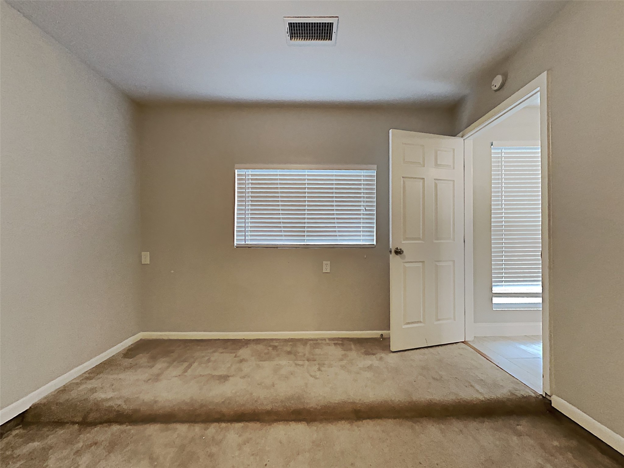 14020 Schroeder Road, Unit 108 Houston, TX 77070 - Photo 14 of 15 a view of a livingroom with a space & window