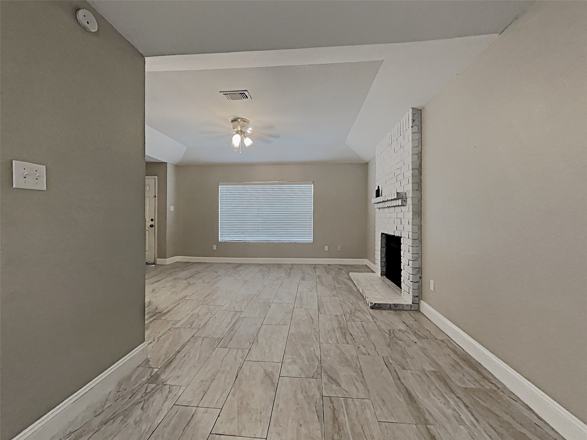 14020 Schroeder Road, Unit 108 Houston, TX 77070 - Photo 6 of 15 an empty room with wooden floor and windows