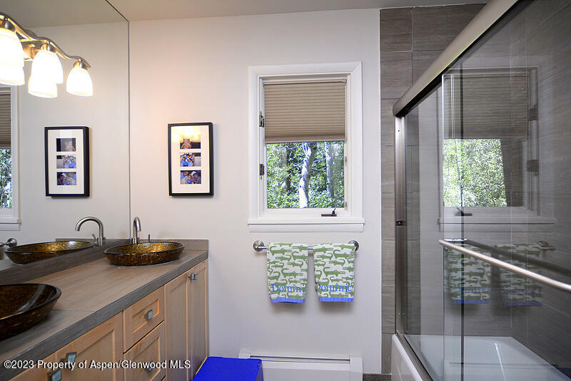 309 Mountain Laurel Drive Aspen, CO 81611 - Photo 12 of 14 a kitchen with a window sink and cabinets