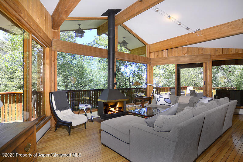 309 Mountain Laurel Drive Aspen, CO 81611 - Photo 3 of 14 a living room with furniture and a large window