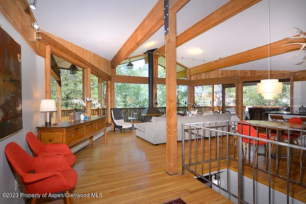 a living room filled with furniture and a large window
