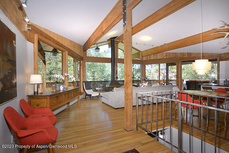 309 Mountain Laurel Drive Aspen, CO 81611 - Photo 4 of 14 a living room filled with furniture and a large window