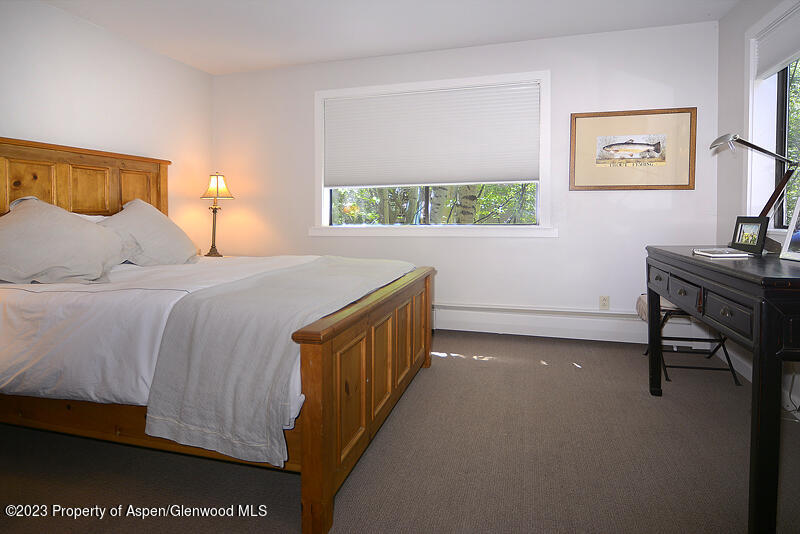 309 Mountain Laurel Drive Aspen, CO 81611 - Photo 9 of 14 a bedroom with a bed and a window