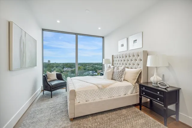 a view of a dining room with furniture and a kitchen view