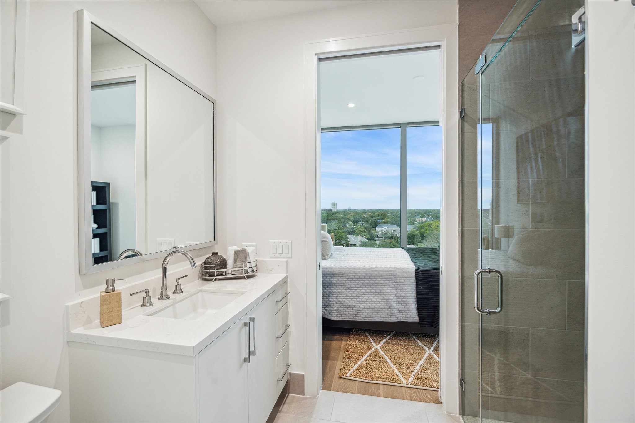 5656 San Felipe Street, Unit 606 Houston, TX 77056 - Photo 31 of 34 a bathroom with a sink a toilet and shower