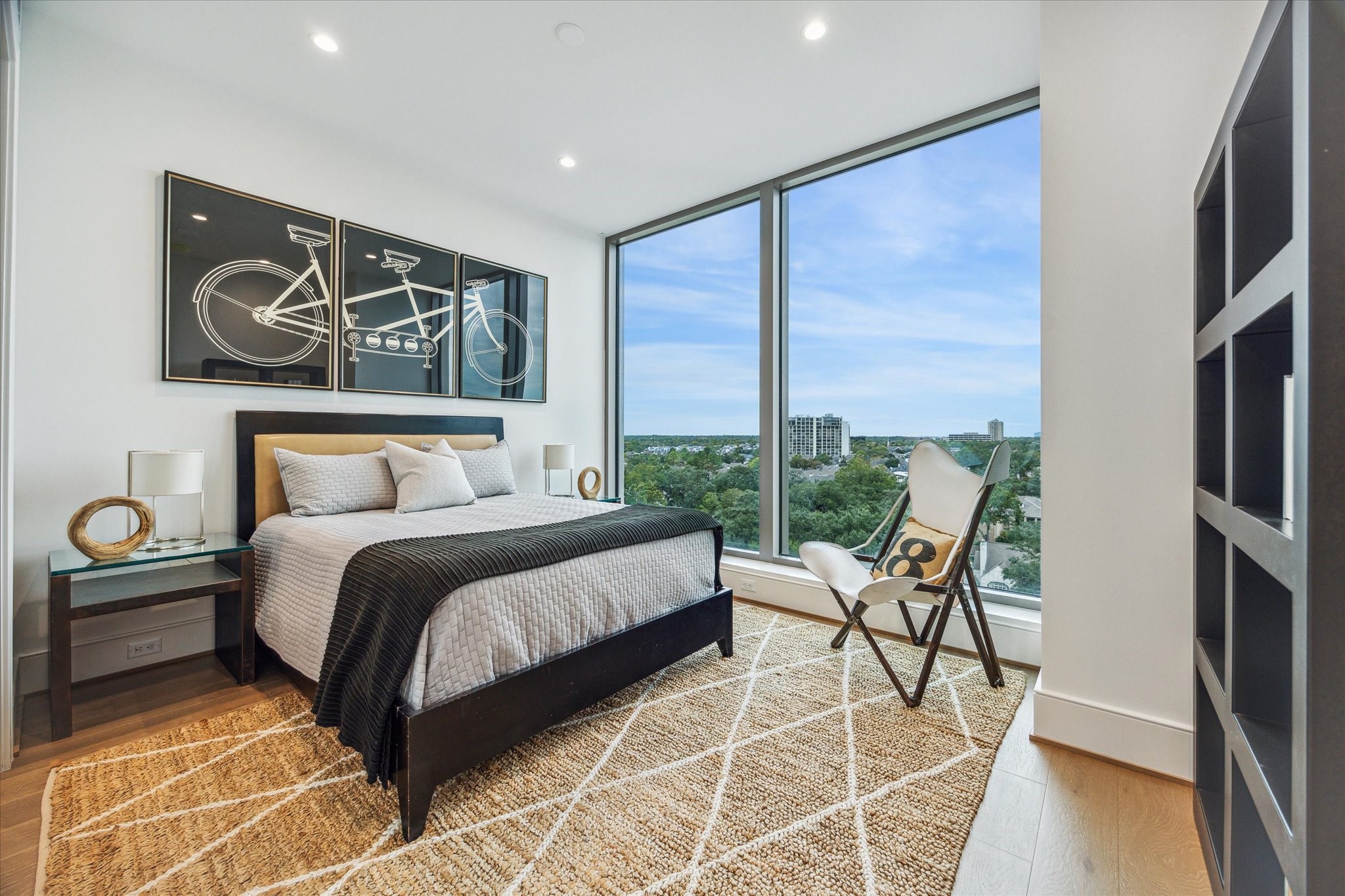 5656 San Felipe Street, Unit 606 Houston, TX 77056 - Photo 32 of 34 a bedroom with a bed and glass walk in closet