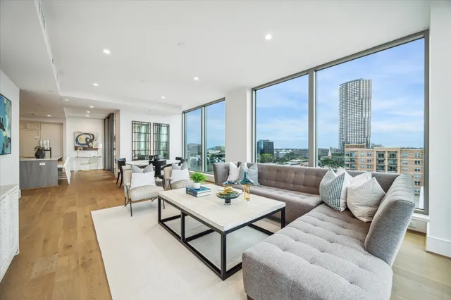 a bedroom with a bed and glass walk in closet