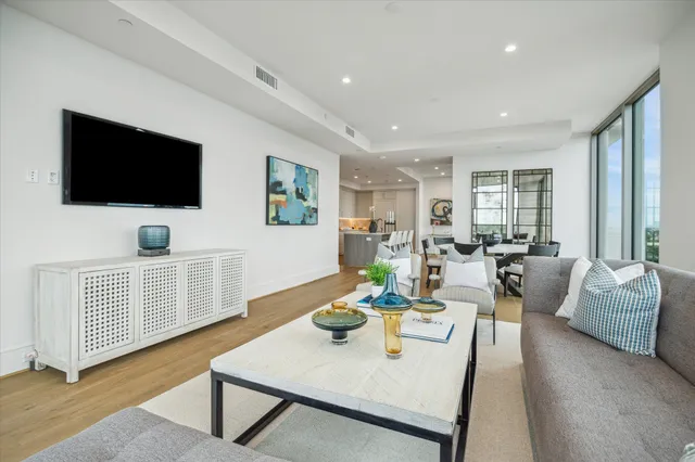 a bedroom with a large bed and a large window