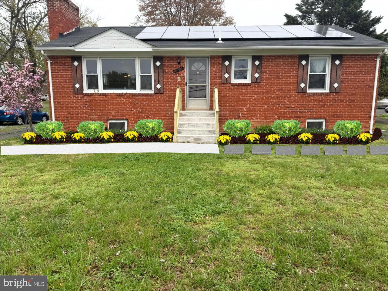 a front view of a house with garden