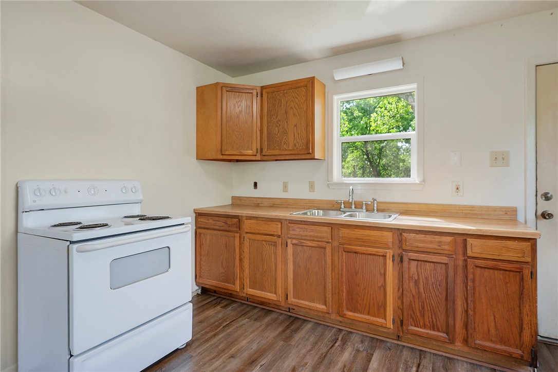 400 Robertson Street Bryan, TX 77803 - Photo 5 of 9 a kitchen with sink stove and cabinets
