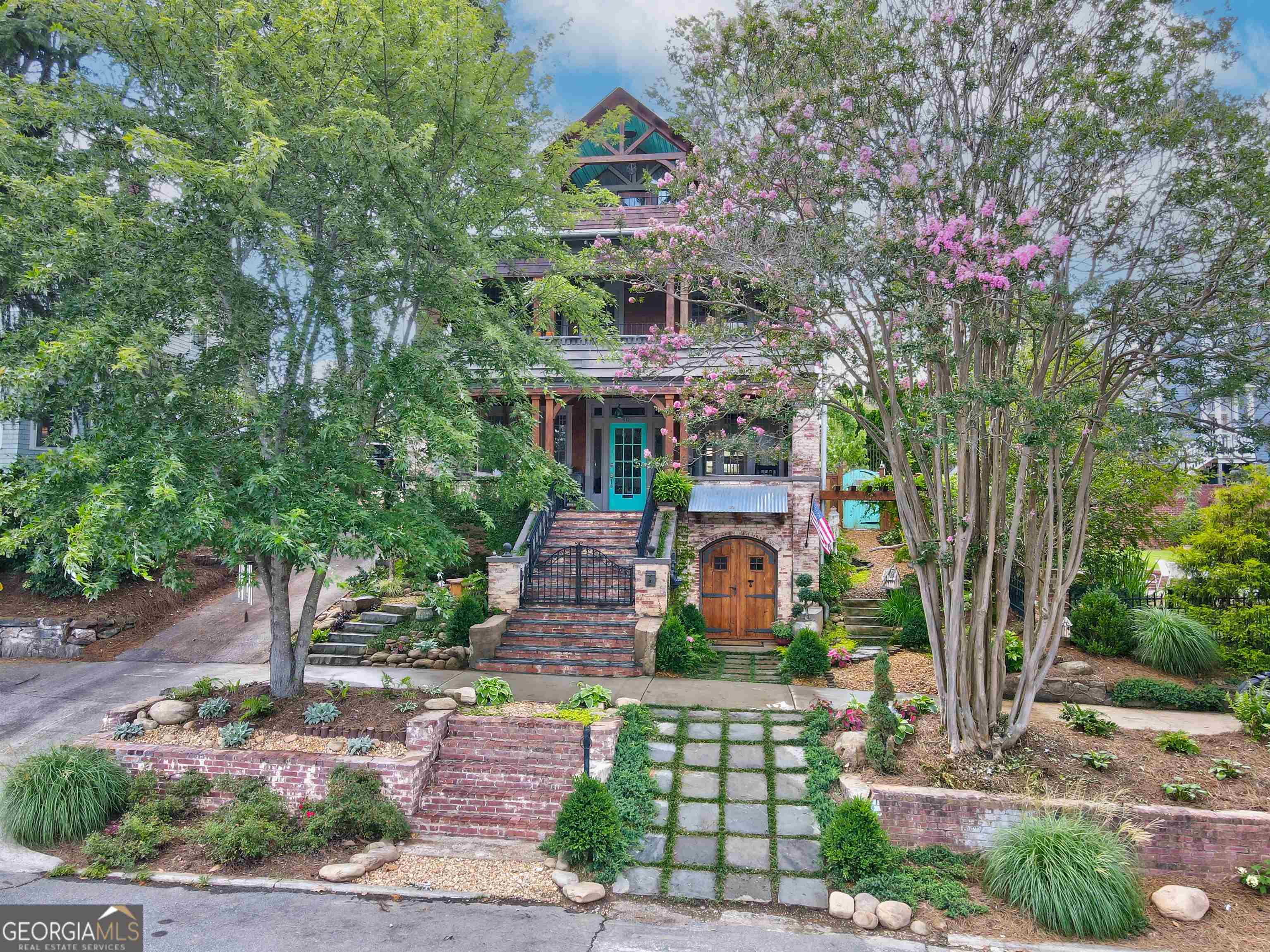a front view of a house with garden