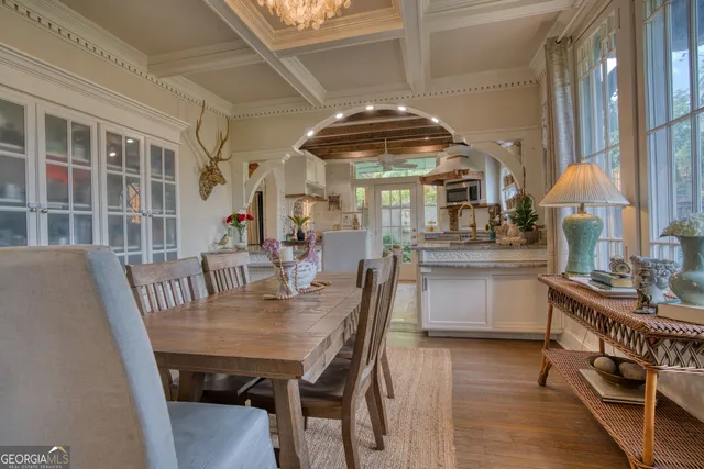 a kitchen with a potted plant on the counter and cabinets