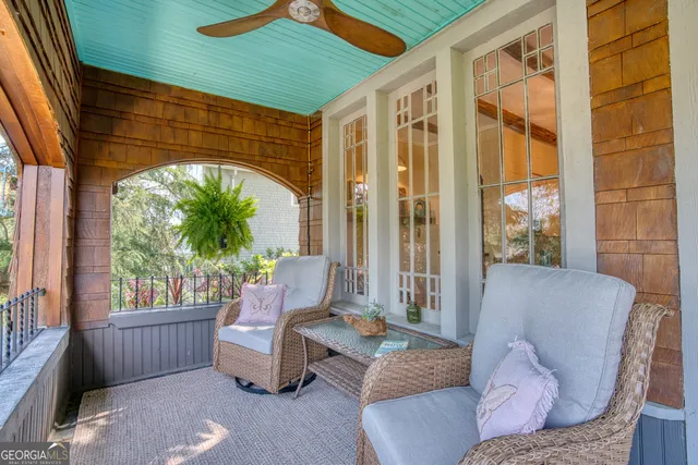 a living room with a couch and next to a window