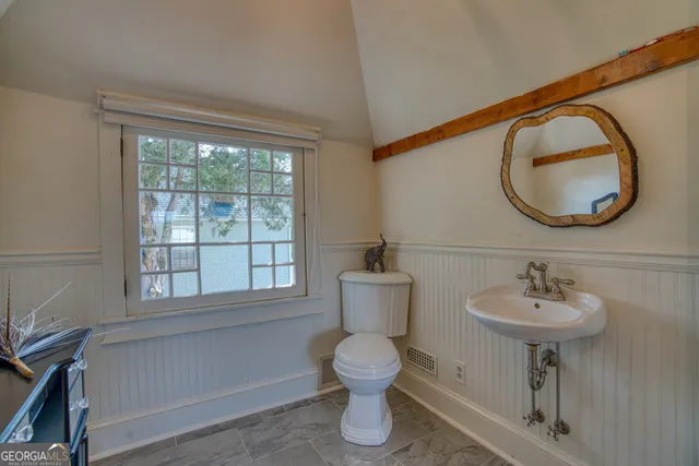 an aerial view of a house with a garden