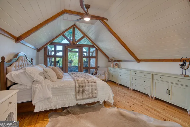 a view of a patio with table and chairs and potted plants