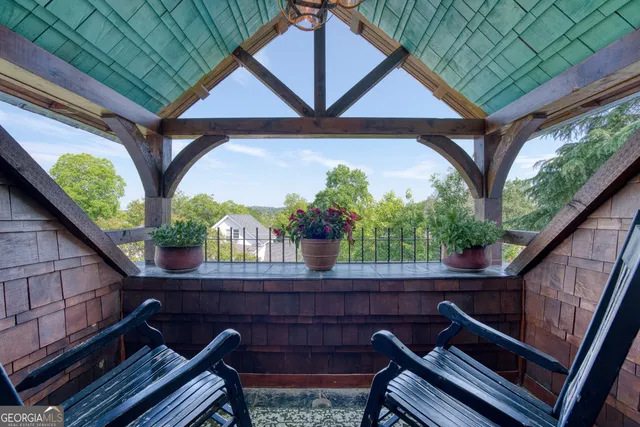a view of a house with a big yard plants and large trees