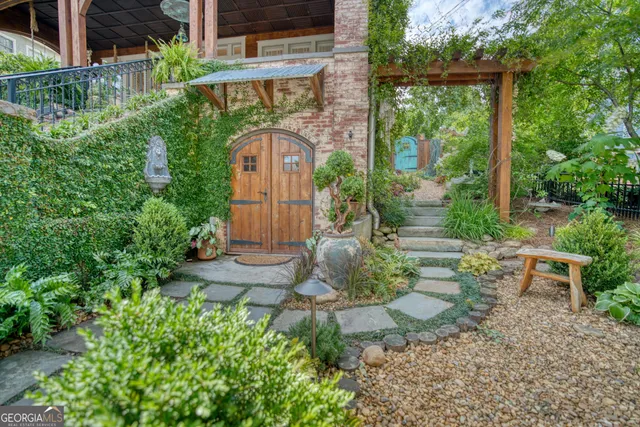 a view of a house with a trees front of house