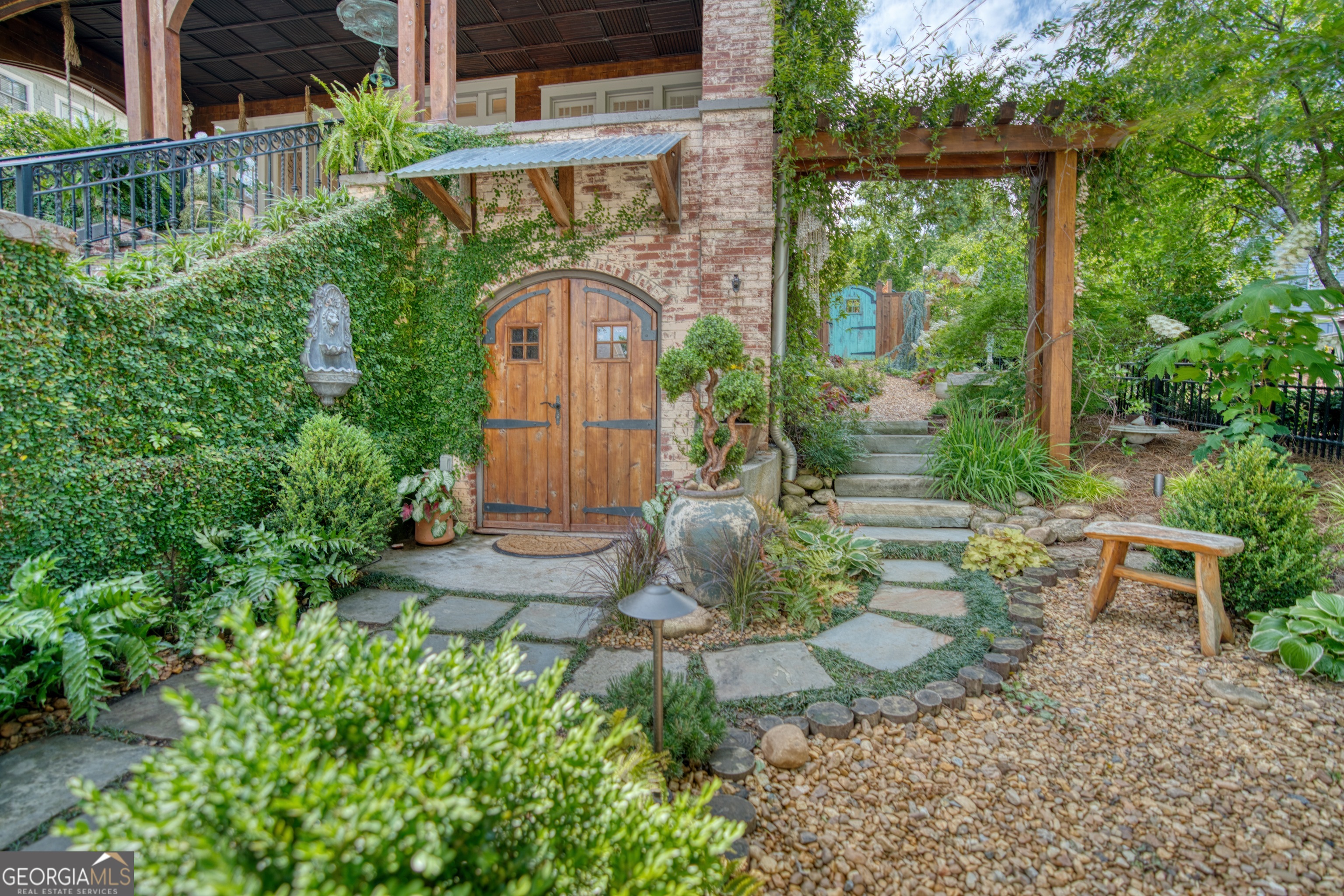 407 East 3rd Street Rome, GA 30161 - Photo 44 of 78 a view of a garden with a bench in patio