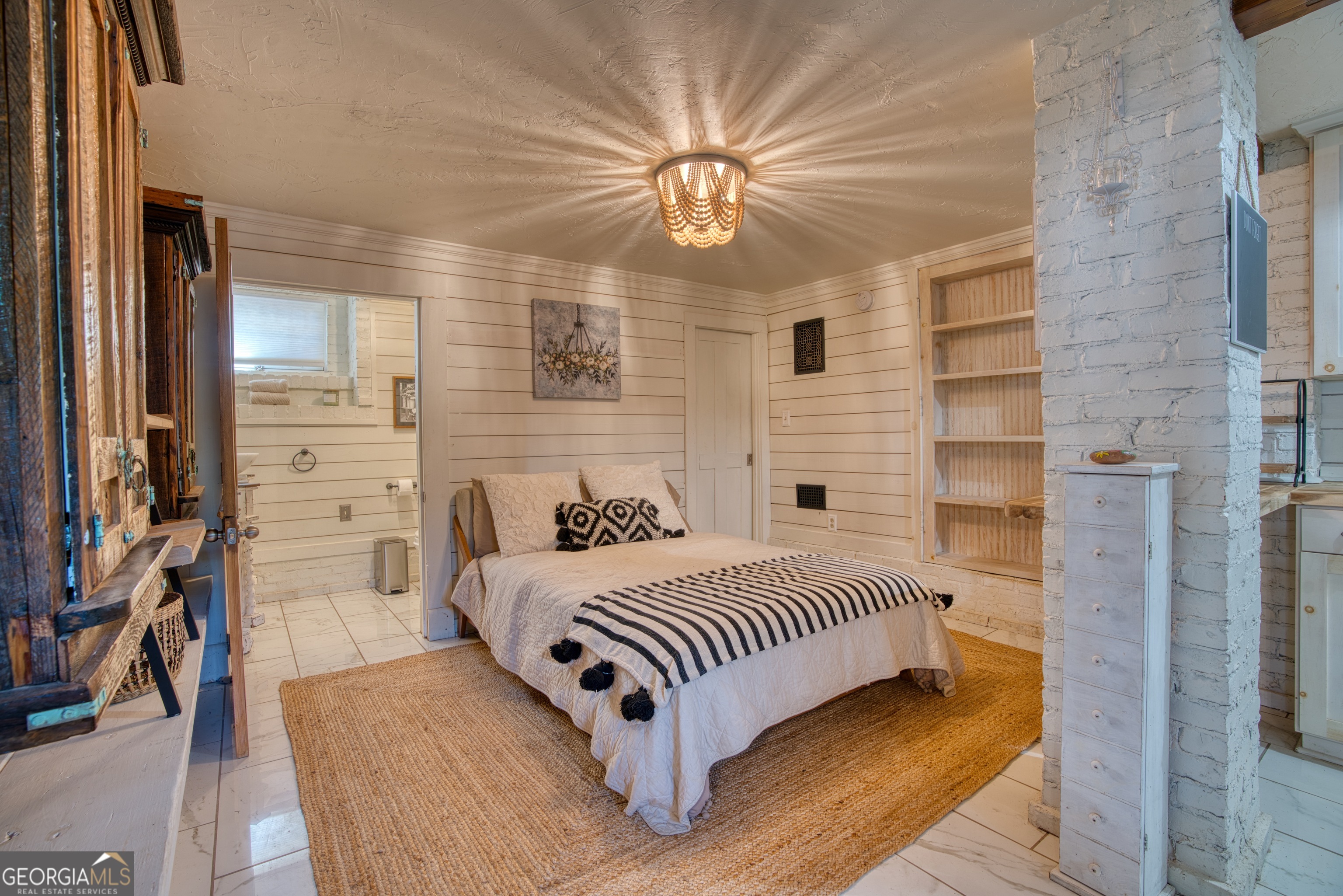 407 East 3rd Street Rome, GA 30161 - Photo 46 of 78 a bedroom with a bed lamp and a fireplace