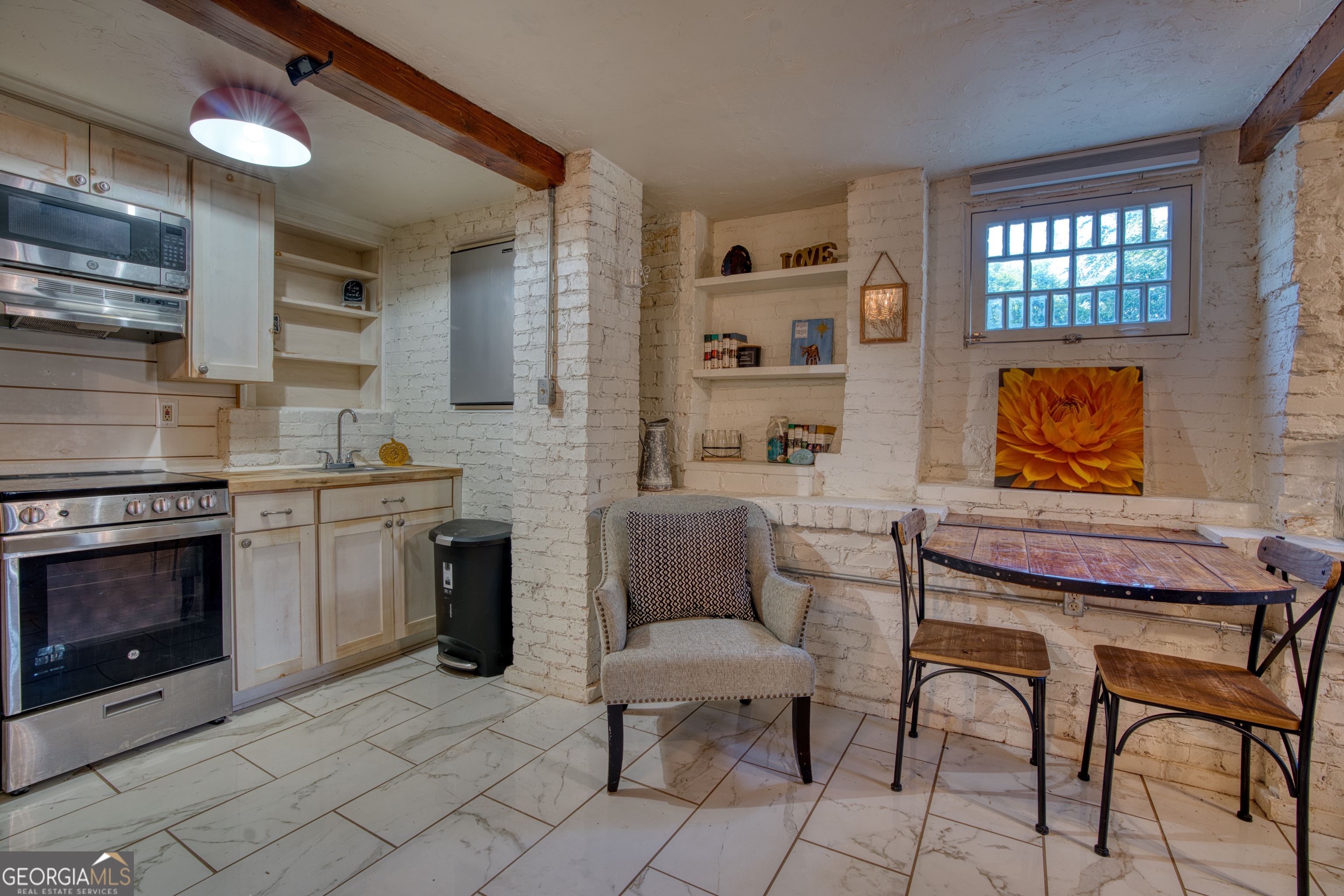 407 East 3rd Street Rome, GA 30161 - Photo 47 of 78 a living room with furniture a fireplace and a flat screen tv