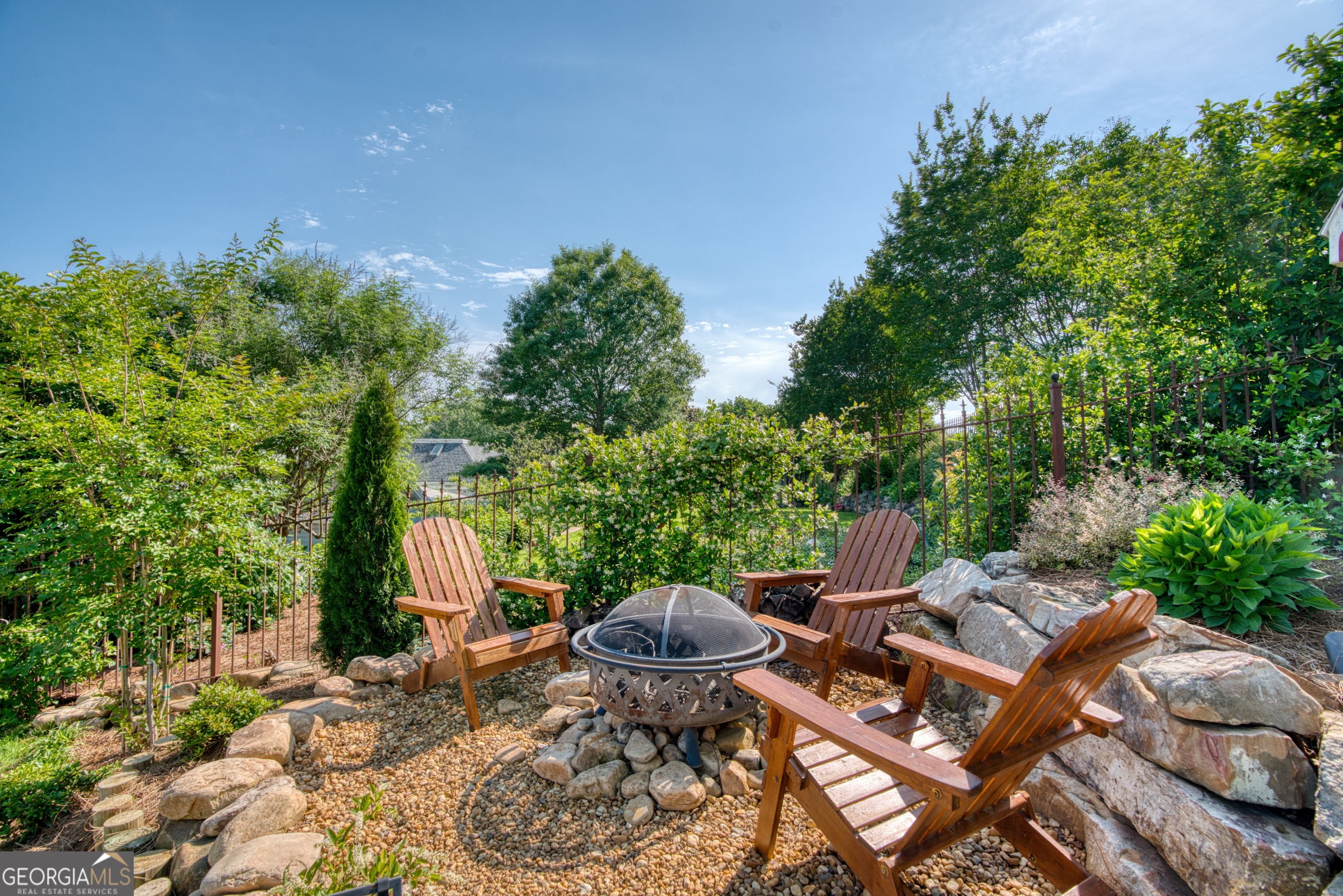 407 East 3rd Street Rome, GA 30161 - Photo 59 of 78 a view of a patio with table and chairs and potted plants