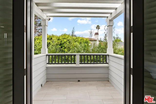 a bathroom with a granite countertop sink a toilet a large mirror and shower